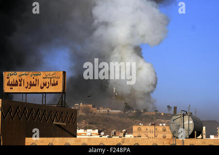 Sanaa, Yemen. 11th Sep, 2015. Smoke rises from Yemen's official TV station which was hit by airstrikes of the Saudi-led coalition forces, in Sanaa, Yemen, on Sept. 11, 2015. Credit:  Hani Ali/Xinhua/Alamy Live News
