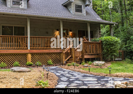 Cabin in North Carolina with flagstone fire pit and front porch Stock Photo