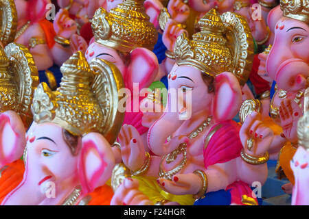 Newly made idols of the Elephant God known as Ganesha or Ganapati for sale at a shop on the eve of Ganesh festival in India. Stock Photo