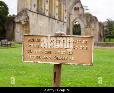 Sign marking the original ancient site of the tombs of King Arthur and Guinevere, Glastonbury Abbey, Somerset, England, UK Stock Photo