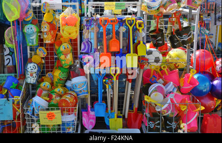 Seaside toys in shop for use by kids on the beach, eg spades,buckets,nets,footballs etc. Stock Photo