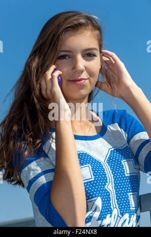 Teenage girl on phone Teen girl talking on phone Age, Young Teenager 15 16 17 Years Old Person Youth Woman, Lucky Teenage Girl Face Happy Attractive Stock Photo