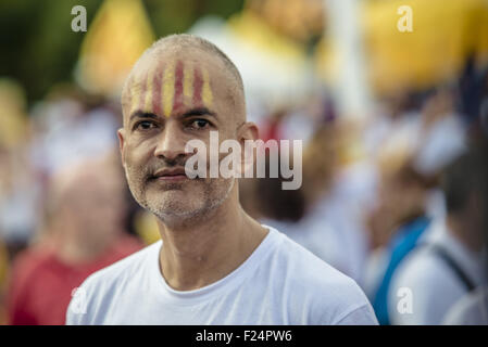 Sept. 11, 2015 - A catalan pro-independence supporter has the Catalan colors painted onto his head during the manifestation in Barcelona's Meridiana Street on Catalonia's national day for the independence from Spain © Matthias Oesterle/ZUMA Wire/Alamy Live News Stock Photo