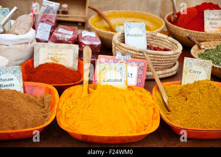 Differents Spices on wooden bowls, street market Stock Photo