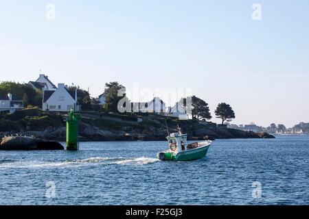 France, Finistere, Concarneau, a small fishing boat leaving the port Stock Photo