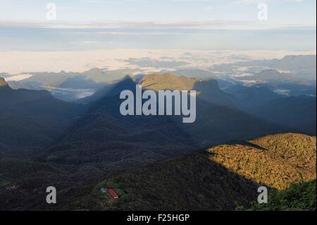 Sri Lanka, center province, Dalhousie, sunrise on Adam's peak, triangle shadow of the peak reflects on the morning haze Stock Photo