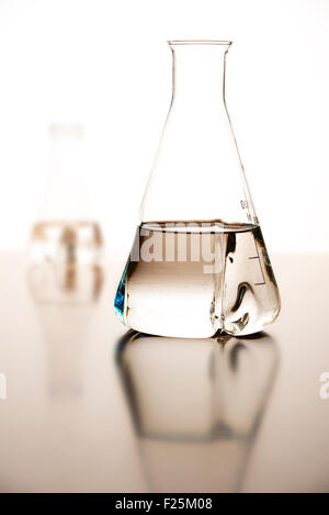 Measuring glasses on a table of a chemical laboratory Stock Photo