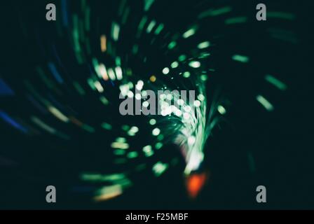information from optic fiber makes luminous vortex ( retro blur background ) Stock Photo