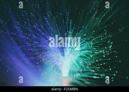 information from optic fiber makes luminous vortex ( blur background ) Stock Photo