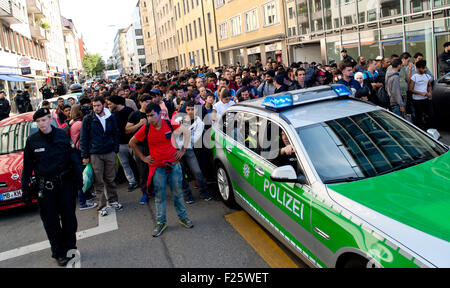 Munich, Germany. 12th Sep, 2015. Refugees, recently arrived by train, are accompanied to accommodation from the central station in Munich, Germany, 12 September 2015. PHOTO: SVEN HOPPE/DPA/Alamy Live News Stock Photo