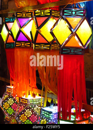 A decorated line of traditional colorful Diwali lanterns lit beautifully on the occasion of Diwali festival in India Stock Photo