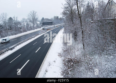 Erlangen,  Germany -DECEMBER 18: German highway in winter period under snow with some cars, daily on December 18.2010 in Erlange Stock Photo