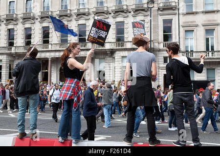 London, UK. 12th September, 2015. Demonstrators march through central London, from Park Lane to Parliament Square, in solidarity with refugees feeing wars in the Middle East and elsewhere. Tens of thousands attended the march, held following a week in which British Prime Minister David Cameron pledged to take up to 20,000 Syrian refugees over the next five years. Credit:  David Cliff/Alamy Live News Stock Photo