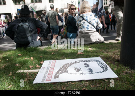 London, UK. 12th Sep, 2015. A placard with a Bashar al-Assad portrait during a solidarity with refugees demonstration in London, UK. Credit:  Noemi Gago/Alamy Live News