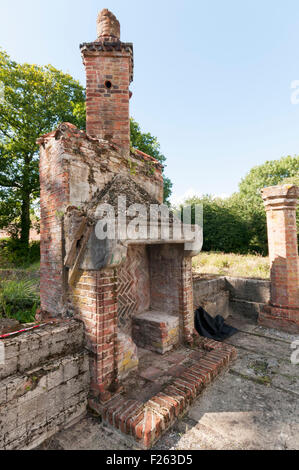 CHISLEHURST, KENT, UK, 12 Sept 2015. The annual open weekend of Scadbury Manor, by Orpington & District Archaeological Society, is held this year on 12-13 September. The remains of the mediaeval moated manor house are located between Chislehurst and Sidcup and visitors are able to follow a guided tour around the site with archaeologists on hand to answer questions. Photograph shows the remains of the Great Hall - the tall fireplace is an early 20th century reconstruction. Credit:  Urbanimages/Alamy Live News Stock Photo