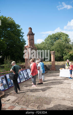 CHISLEHURST, KENT, UK, 12 Sept 2015. The annual open weekend of Scadbury Manor, by Orpington & District Archaeological Society, is held this year on 12-13 September. The remains of the mediaeval moated manor house are located between Chislehurst and Sidcup and visitors are able to follow a guided tour around the site with archaeologists on hand to answer questions. Photograph shows the remains of the Great Hall - the tall fireplace is an early 20th century reconstruction. Credit:  SJ Images/Alamy Live News Stock Photo