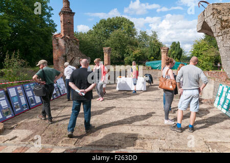 CHISLEHURST, KENT, UK, 12 Sept 2015. The annual open weekend of Scadbury Manor, by Orpington & District Archaeological Society, is held this year on 12-13 September. The remains of the mediaeval moated manor house are located between Chislehurst and Sidcup and visitors are able to follow a guided tour around the site with archaeologists on hand to answer questions. Photograph shows the remains of the Great Hall - the tall fireplace is an early 20th century reconstruction. Credit:  SJ Images/Alamy Live News Stock Photo