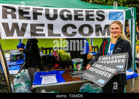 Glasgow, Scotland, UK. 12th September, 2015. Despite the heavy rain, about 2000 people attended a candlelight vigil in George Square, Glasgow showing support for the Syrian refugees. Recently Glasgow Council who already provides homes for 55 Syrians, announced  that it will take an additional 60 refugees. Frank McAveety, the newly appointed leader of Glasgow Council attended the rally. Credit:  Findlay/Alamy Live News Stock Photo