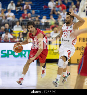 Serbia's Milos Teodosic (l) and Turkey's Hueseyin Koeksal (r) in action during the FIBA EuroBasket 2015 Group B match Turkey vs Serbia in at the Mercedes-Benz-Arena in Berlin, Germany, 09 September 2015. Photo: Lukas Schulze/dpa Stock Photo