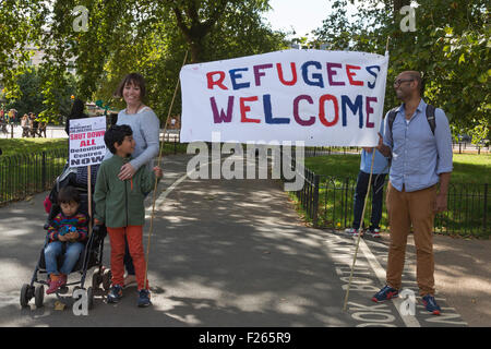 London, UK. 12th September, 2015.  A Refugees Welcome poster. Tens of thousands of people take part in the Solidarity with Refugees demonstration in Central London calling on David Cameron to take effective action to turn the refugee crisis around and accept the UK’s fair share of refugees already in Europe. Vibrant Pictures/Alamy Live News Stock Photo
