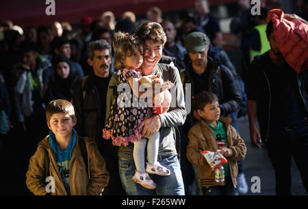 Munich, Germany. 12th Sep, 2015. A refugee family who have recently arrived by train at the central station in Munich, Germany, 12 September 2015. PHOTO: NICOLAS ARMER/DPA/Alamy Live News Stock Photo