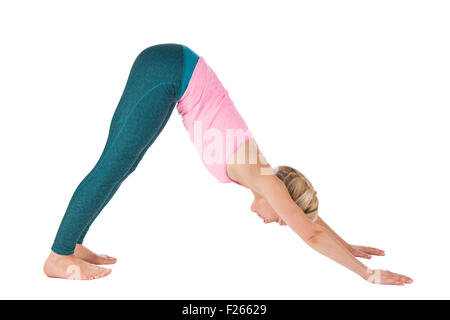 Yoga series picture: Full lateral profile view of a middle-aged blonde woman doing yoga exercise dog (Downward Facing Dog Pose Stock Photo