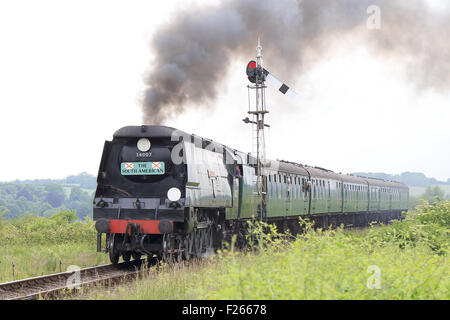 The preserved steam locomotive, 'Wadebridge' 34007, pulling passenger carriages on the 'Watercress Line', Hampshire, England, UK Stock Photo