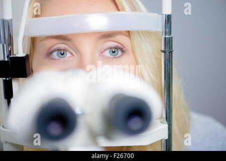 Blond woman having an eye exam Stock Photo