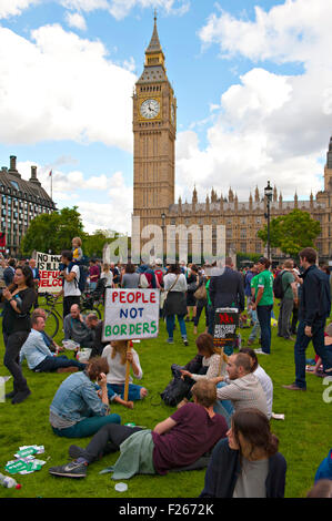 London, UK. 12th Sep, 2015. Demonstrators gather in front of Big Ben and the Palace of Westminster at a rally to show solidarity with the Syrian refugees. Credit:  patrick nairne/Alamy Live News Stock Photo