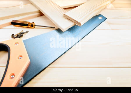 Assorted work tools on wooden background Stock Photo