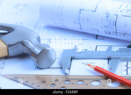 Architectural blueprints rolls and engineering items. Toned in blue. Soft light Stock Photo