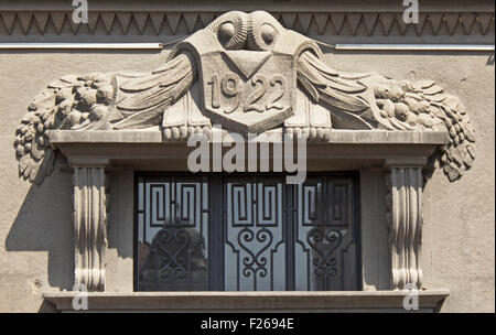 Ornament above the entrance to the building from 20 's. Stock Photo