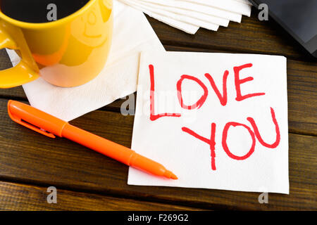 Love you -  handwriting on a napkin with a cup of coffee and phone Stock Photo