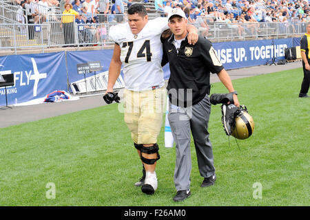 September 12, 2015 - Army Black Knights offensive lineman Jaryn Villegas (74) is helped to the locker room during the NCAA football game between the Army Black Knights and the Connecticut Huskies held at Pratt & Whitney Stadium Stadium at Rentschler Field in East Hartford Connecticut. The Connecticut Huskies defeated the Army Black Knights 22-17. Eric Canha/CSM Stock Photo