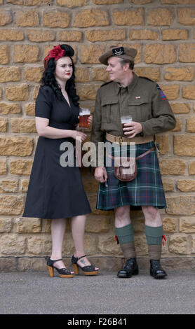 Stoke Bruerne, Northamptonshire,  Village at war 1940's re-enactment.A man in a kilt with a lady in 1940's fashion. Credit:  Scott Carruthers/Alamy Live News Stock Photo