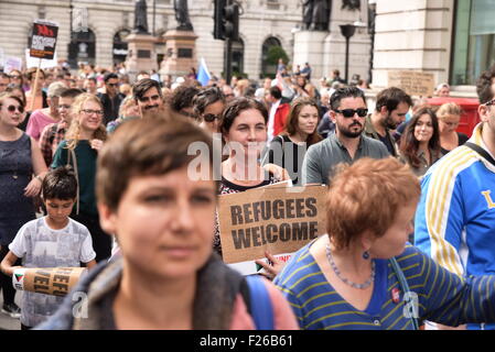 London, UK. 12th Sep, 2015. Thousands march through central London on a demonstration to say 'refugees welcome here'. Stock Photo