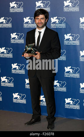 Venice, Italy. 12th Sep, 2015. Director Emin Alper poses with the Special Jury Prize for the movie 'Abluka', as he attends the award winners photocall during the 72nd Venice Film Festival, at the Lido of Venice, Italy, Sept. 12, 2015. © Ye Pingfan/Xinhua/Alamy Live News Stock Photo