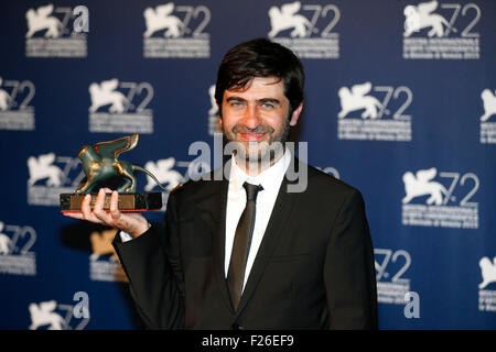 Venice, Italy. 12th Sep, 2015. Director Emin Alper poses with the Special Jury Prize for the movie 'Abluka', as he attends the award winners photocall during the 72nd Venice Film Festival, at the Lido of Venice, Italy, Sept. 12, 2015. © Ye Pingfan/Xinhua/Alamy Live News Stock Photo