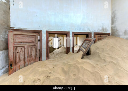 The abandoned ghost diamond town of Kolmanskop in Namibia, which is slowly being swallowed by the desert.