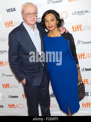 Toronto, Canada. 12th Sep, 2015. Actor Michael Caine (L) and his wife pose for photos before the North American premiere of the film 'Youth' at the Elgin Theatre during the 40th Toronto International Film Festival in Toronto, Canada, Sept. 12, 2015. © Zou Zheng/Xinhua/Alamy Live News Stock Photo