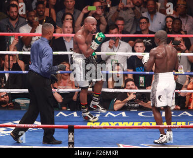 Las Vegas, Nevada, USA. 12th Sep, 2015. Champion Floyd Mayweather jr and challenger Andre Berto engage each other during their WBA AND wbc World Welter weight title match on September 12, 2015 at MGM Grand Arena in Las Vegas, Nevada. Mayweather won via unanimous decision, making his record 49-0 and tying the record of former Heavyweight champion Rocky Marciano. Credit:  Marcel Thomas/ZUMA Wire/Alamy Live News Stock Photo