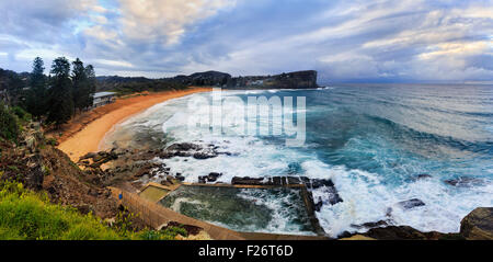 Panoramic view from elevated look-out towards remote australian beach Avalon with rock-pool and pristine sand and water Stock Photo