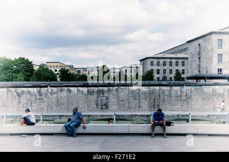 Berlin. Tourists visit Topography of Terror indoor and outdoor museum & memorial - Excavated Gestapo building & Berlin Wall Stock Photo