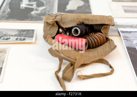 Balls of thread and other objects inside a jute bag Stock Photo