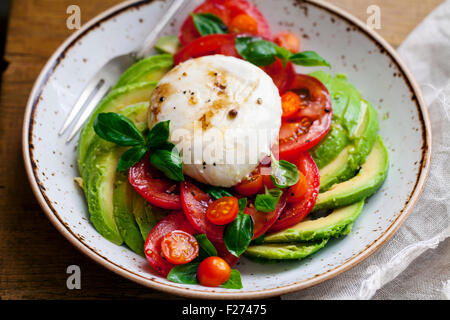 Tomatoes. mozzarella and avocado salad Stock Photo