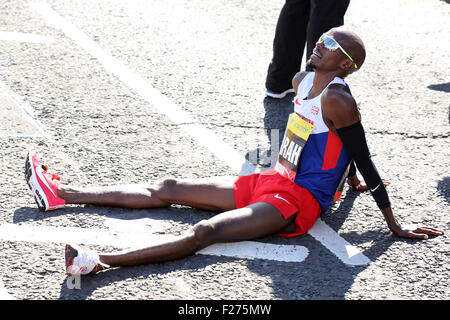 South Shields, UK. 13th Sep, 2015. Mo Farah, sits on the ground after winning the men's elite race at the Morrison's Great North Run, in South Shields, England. Farah won the race in a British record time of 59 minutes 22 seconds. Credit:  Stuart Forster/Alamy Live News Stock Photo