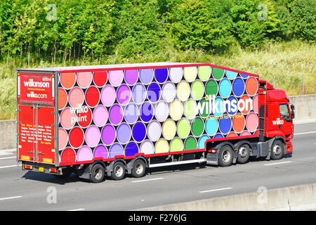 Wilko paint brand using coloured tin lids as advertising on side of Wilkinson discount chain store delivery articulated trailer & hgv lorry truck UK Stock Photo