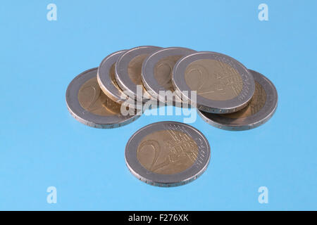 Close up photo of Euro coins on a blue chromakey background Stock Photo