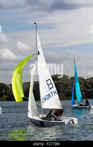 Southport, Merseyside, UK. 13th September, 2015. The Southport 24 Hour Race is a national sailing endurance race for two-handed sailing dinghies, with 63 Firefly, Lark, Enterprise and GP 14 boats competing. The race, hosted by the West Lancs Yacht Club, has a long history and is usually held in September. The race starts at 12 noon on the Saturday. The contestants then race their dinghies around the marine lake finishing at noon today.  During the hours of darkness, the helm and crew of each dinghy must keep a careful watch for other boats (often capsized). Stock Photo