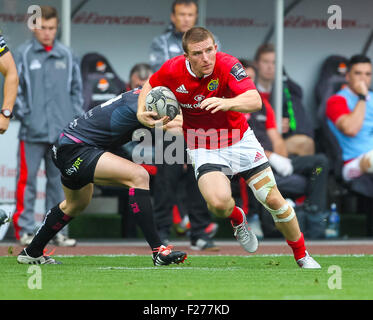 Swansea, Wales. 13th Sep, 2015. Guinness Pro12. Ospreys versus Munster Rugby. Munster's Andrew Conway beats Ospreys Kristian Phillips. © Action Plus Sports/Alamy Live News Stock Photo